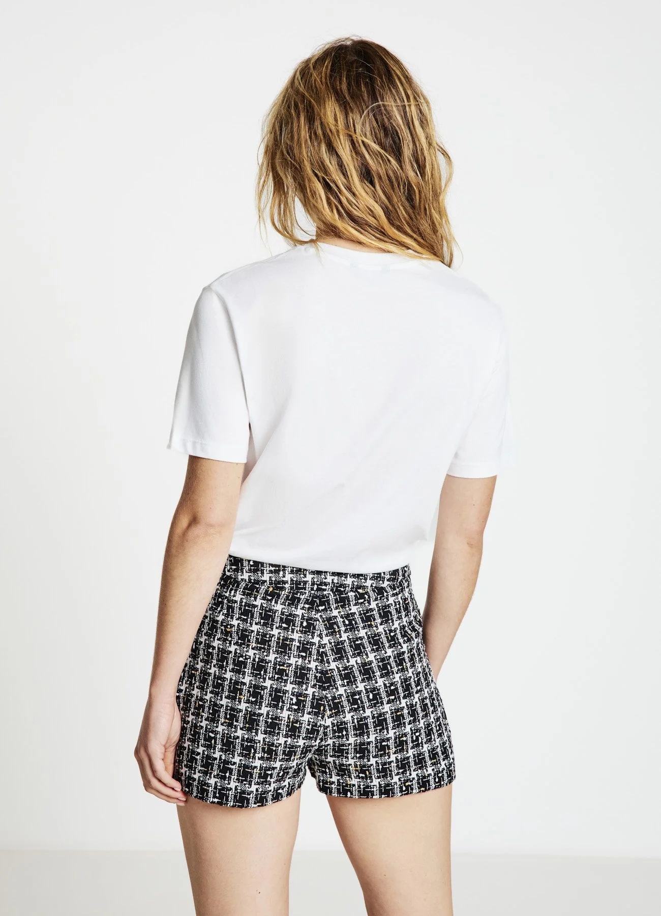 Gonna-pantalone in tweed con fantasia