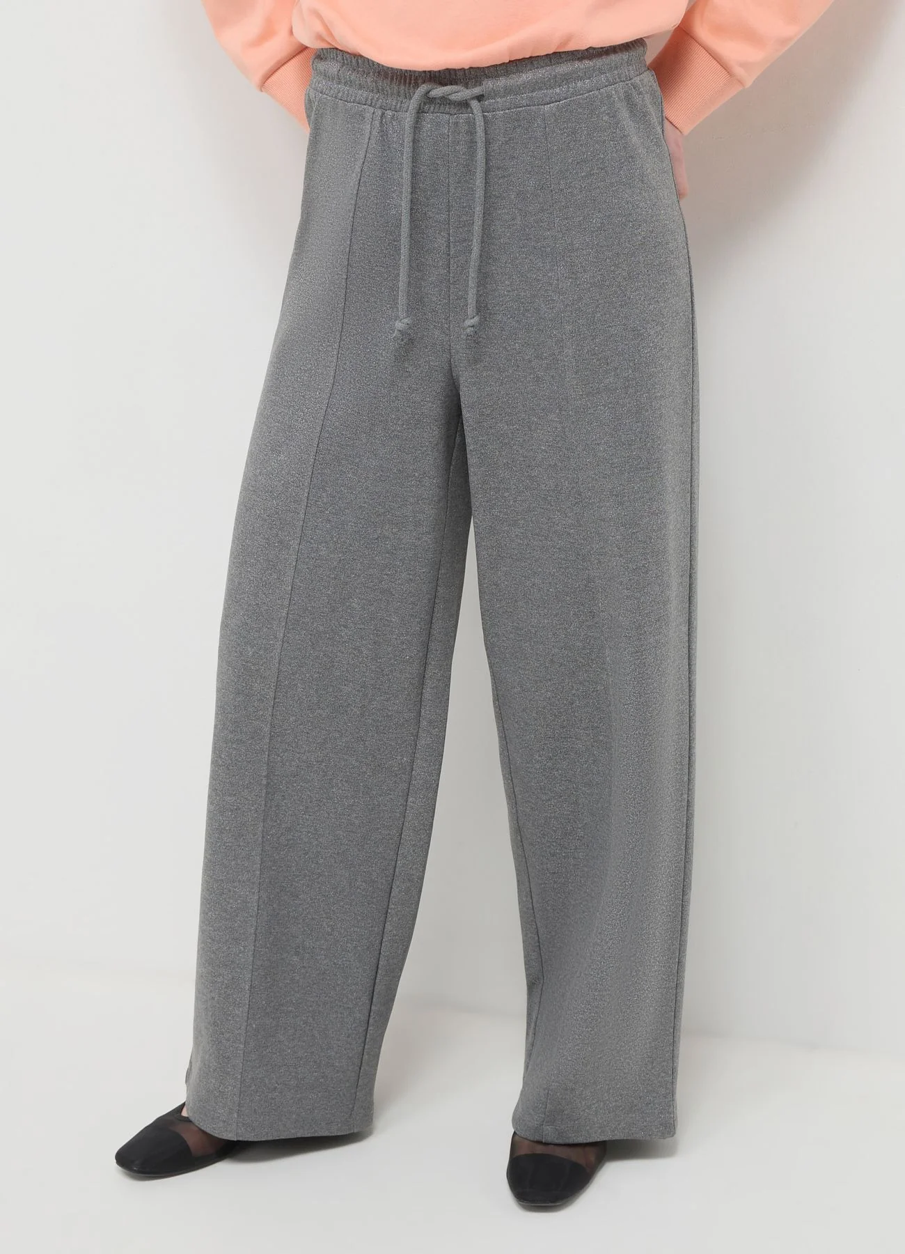 Pantalone a palazzo effetto luminescente