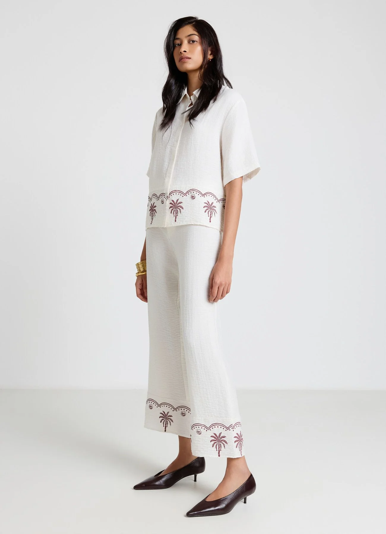 Pantaloni straight con ricamo palme