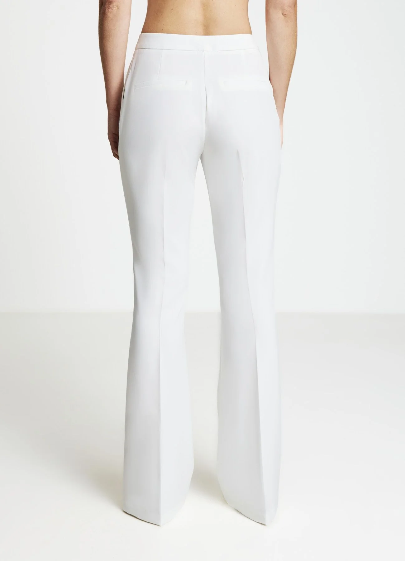Pantaloni zampa tinta unita