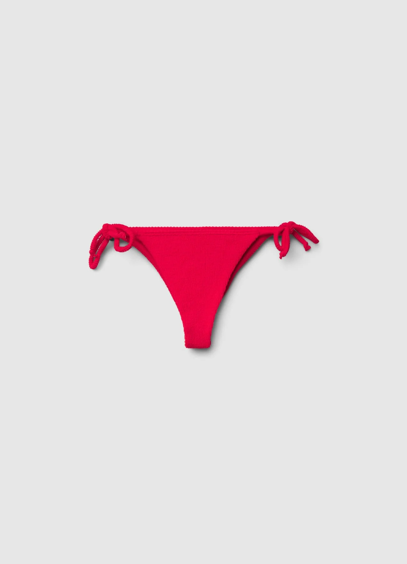 Slip bikini brasiliana goffrata con lacci laterali