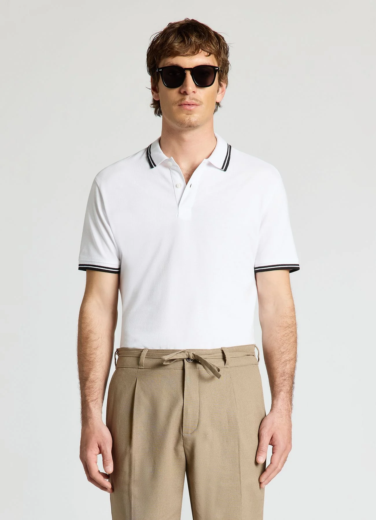T-shirt polo con profili a righe