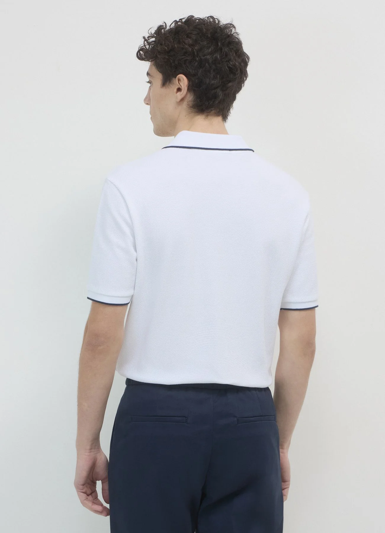 T-shirt polo tessuto operato