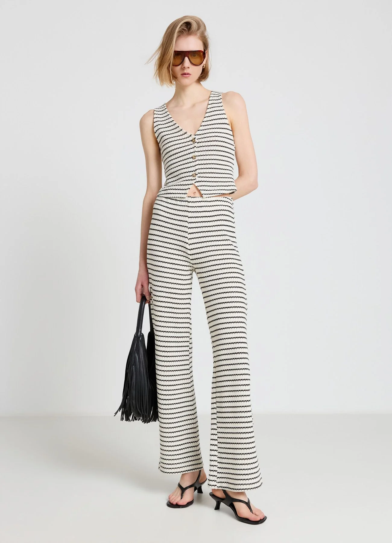 Top in maglia a righe con bottoni